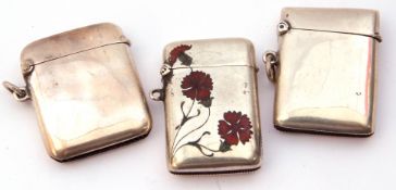 Mixed Lot: Continental white metal and enamel vesta, the front inlaid with red enamel flowers and