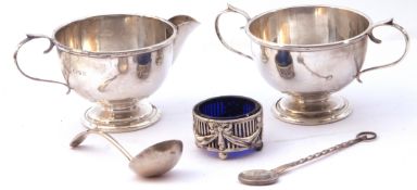 Mixed lot (5). George V silver cream jug and twin handled sugar bowl of circular form with beaded