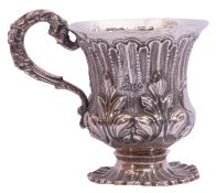William IV silver christening mug with a deep relief scroll and fluted decoration around the body,