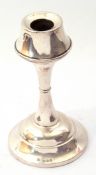 George V silver candlesticks, the inverted sconce on a waisted stem on a spreading foot (loaded),