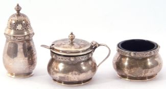 George VI three-piece silver condiment set, of baluster form, the rims with embossed and engraved