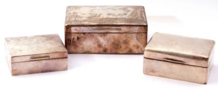 Mixed Lot: Three silver table cigarette boxes, large rectangular box with engraved presentation to