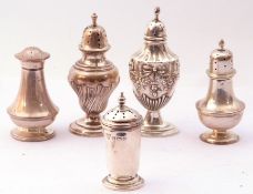 Mixed Lot: five various silver peppers, three of urn shaped and baluster form, a cylindrical