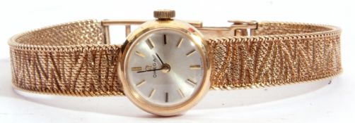 Third quarter of 20th century ladies cased 9ct gold Omega wrist watch with integral naturalistically