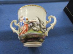 SMALL TWIN HANDLED PORCELAIN CUP MOULDED WITH MYTHICAL SCENES DEPICTING CHARACTERS IN CHARIOTS