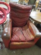 LARGE EARLY TO MID 20TH CENTURY LEATHER UPHOLSTERED ARMCHAIR