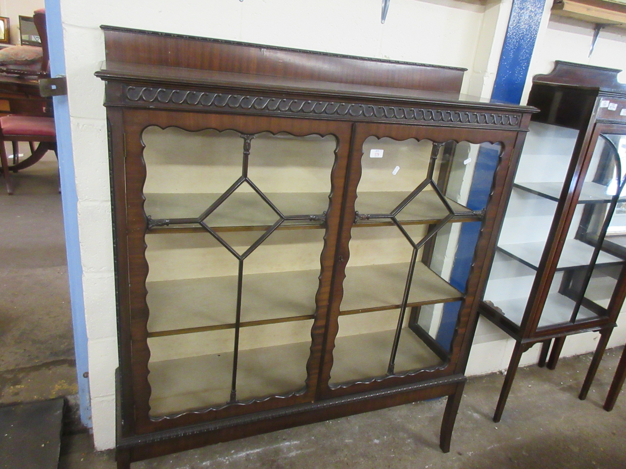 EARLY 20TH CENTURY MAHOGANY CHINA CABINET WITH ASTRAGAL GLAZING AND CARVED DETAIL THROUGHOUT,