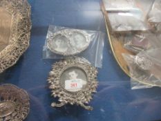 TWO SMALL ORNATE SILVER PLATED PHOTOGRAPH FRAMES