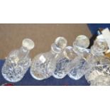 Group of four cut glass decanters, various sizes, with stoppers, largest 30cm high (4)