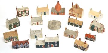 Collection of small Goss cottages including Manx cottage, model of an oven in which Goss porcelain