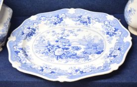 Large mid-19th century platter with a flow blue design, the reverse with Italian flower garden in