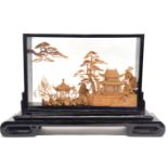 Oriental paper diorama in black wooden frame