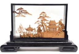 Oriental paper diorama in black wooden frame