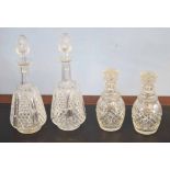 Pair of late 19th century cut glass decanters and stoppers and two further decanters with mushroom