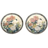 Pair of Japanese porcelain dishes decorated with floral sprays and butterflies, 36cm diam (2)