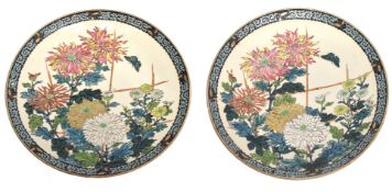 Pair of Japanese porcelain dishes decorated with floral sprays and butterflies, 36cm diam (2)