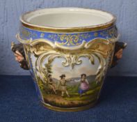 Continental porcelain jardiniere with a couple dancing on the front with Bacchus style hands, the