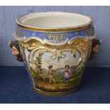 Continental porcelain jardiniere with a couple dancing on the front with Bacchus style hands, the