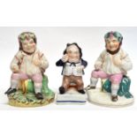 Three 19th century figures of topers mounted on green bases