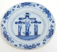 18th century Delft plate depicting the crucifixion of Christ, decorated in underglaze blue and