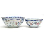 Two 18th century Chinese porcelain bowls, one with polychrome decoration and the larger with blue