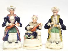 Group of Staffordshire porcelaneous figures, one as a pen holder, all modelled as Middle Eastern