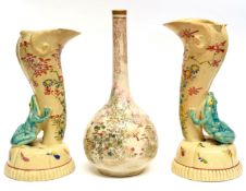 Pair of Japanese earthenware vases, flanked by frogs in green, together with a Satsuma bottle