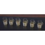 Collection of six small liquor or shot glasses in silver frames, the silver hallmarked for
