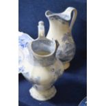 Two mid-19th century large water jugs, both with flow blue designs, largest 31cm high