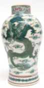 Oriental vase decorated in famille vert palette with a dragon chasing the flaming pearl