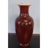 Large Chinese baluster flambe sang de beouf vase with a streaked red and black design, 60cm high