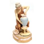 Mid-20th century Royal Dux figure of a potter modelled as a Grecian lady at a potting wheel on
