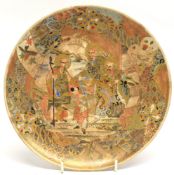 Japanese Satsuma plate decorated with figures in a landscape, 22cm diam