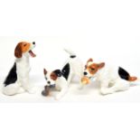 Three Royal Doulton novelty dogs, one with ball, another chewing a slipper, and one yawning (3)