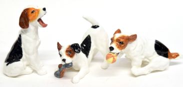 Three Royal Doulton novelty dogs, one with ball, another chewing a slipper, and one yawning (3)