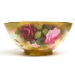 Large Royal Worcester fruit bowl painted with roses in typical fashion, signed by Austin, (crack