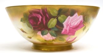 Large Royal Worcester fruit bowl painted with roses in typical fashion, signed by Austin, (crack