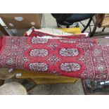 RED RUNNER WITH GEOMETRIC PATTERN TRHOUGHOUT WIDTH APPROX 64CM