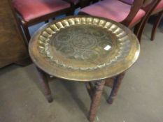 LARGE INDIAN BRASS TRAY ON FOLDING WOODEN SUPPORT, APPROX DIAM 59CM