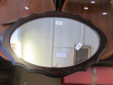 OVAL MIRROR WITHIN A SCALLOPED WOODEN FRAME, LENGTH APPROX 57CM