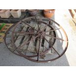 TWO VERY LARGE VINTAGE IRON WHEELS ONE NAMED FOR NICHOLSONS NEWARK NUMBERED 925X PROBABLY FROM