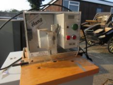 HANG ELECTRIC STITCHING MACHINE MOUNTED ON A THREE DRAWER METAL FILING CABINET