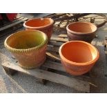 FOUR VARIOUS CIRCULAR TERRACOTTA PLANTERS THE LARGEST APPROX 45CM DIAMETER