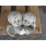 COMPOSITION GARDEN WALL PLAQUE DEPICTING TWO CHERUBS WIDTH APPROX 26CM