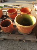 FOUR VARIOUS DECORATIVE LARGE TERRACOTTA PLANTERS THE LARGEST APRROX 45CM