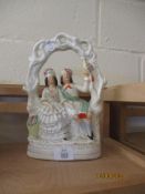 STAFFORDSHIRE STYLE FIGURE OF A GENT AND A LADY TOGETHER