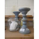 TWO PAINTED WOODEN CANDLE STICKS TOGETHER WITH TWO GLASS CANDLE HOLDERS