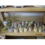 GROUP OF MINIATURE CHINA SHOE ORNAMENTS TO INCLUDE ONE WITH CLOCK