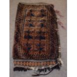 Large camel bag decorated on one side with geometric designs on a mainly brown and orange