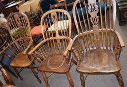 Two oak converted Windsor style commode chairs and a further Windsor style stick back armchair (3)